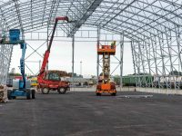 Lift with platform work in warehouse hangar construction field.